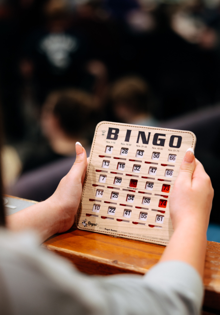 Woman Holding Bingo Card