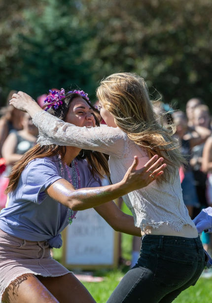 Two girls hugging outisde