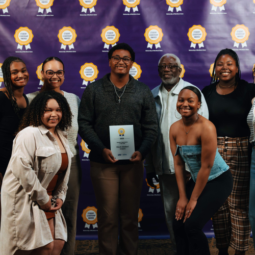 Seven student organization members with their advisor
