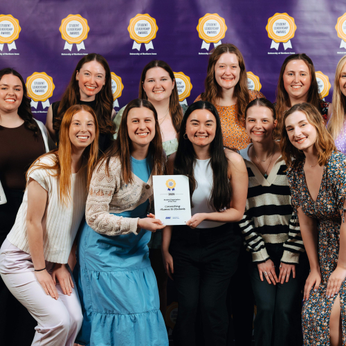 Ten student organization members with their advisor