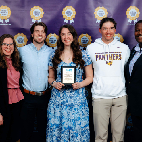 Four student organization members with their advisor