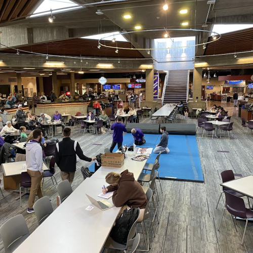 Aerial view of the inside of Maucker Union with 2 wrestlers on a mat